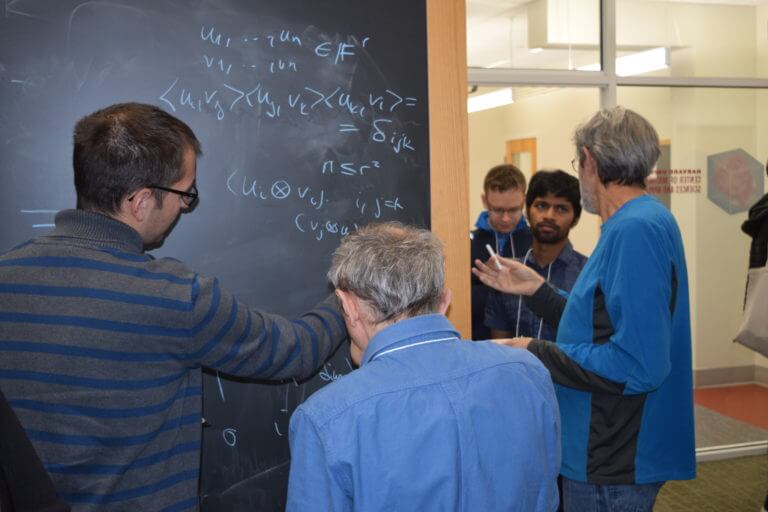 Scenes from The Workshop on Algebraic Methods in Combinatorics