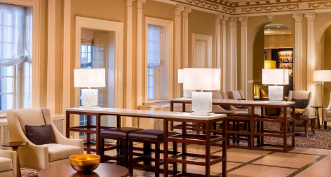 Internal structure of the Hotel showing dining room filled with table chair table lamp