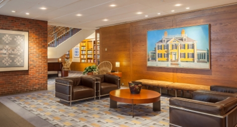 Internal structure of the Hotel showing sitting room with sofa set and picture on wall